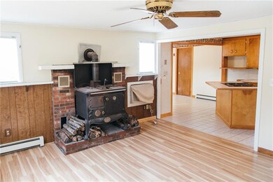 The living room has a wood stove for...