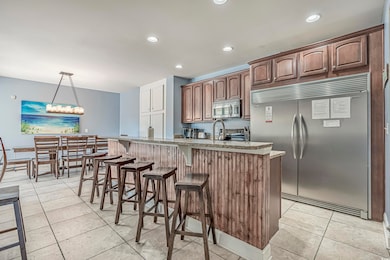 Kitchen with a breakfast bar, appliances with stai