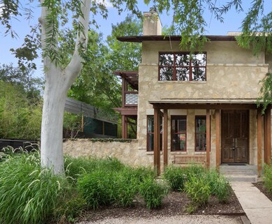 View of front of property featuring a chimney and