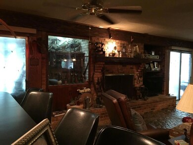 Living Room with fireplace and built-in gun cabinet