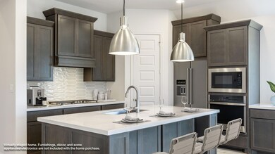 Kitchen featuring a sink, appliances with stainle