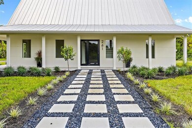 View of exterior entry with covered porch