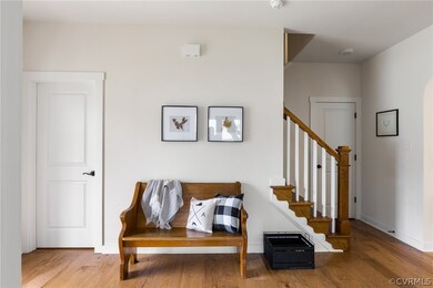 Living area with hardwood / wood-style floors