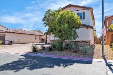 View of front of house with stucco siding, a tiled