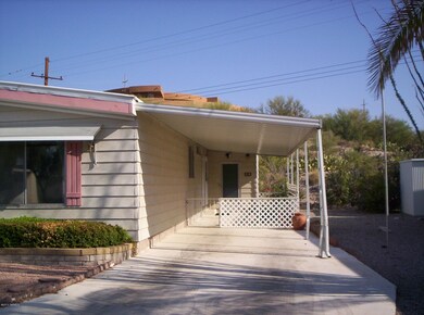Carport with work shop at rear.