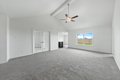 Unfurnished living room featuring high vaulted ceiling, carpet floors, beam ceiling, french doors, and a ceiling fan