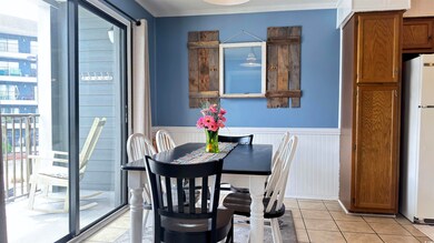 Dining space with light tile patterned flooring