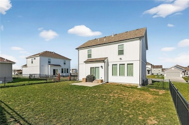 Rear view of property featuring a patio, a fenced backyard, and a residential view
