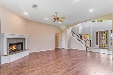 Unfurnished living room featuring wood finished f
