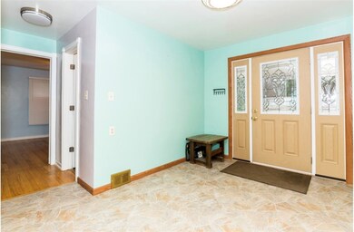 Enter the kitchen through the back porch door