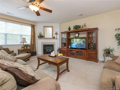 Open family room with gas log fireplace.