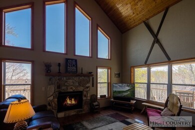 Tall glass windows: View looking out to the mountains from inside.
