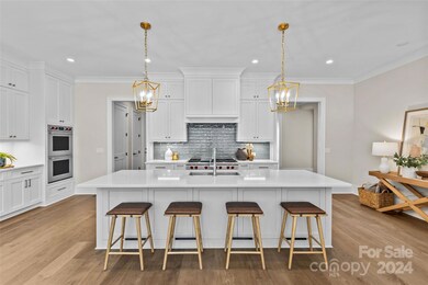 Large kitchen island with quartz countertops