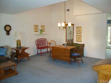 Large dining area with open ceiling provides comfo
