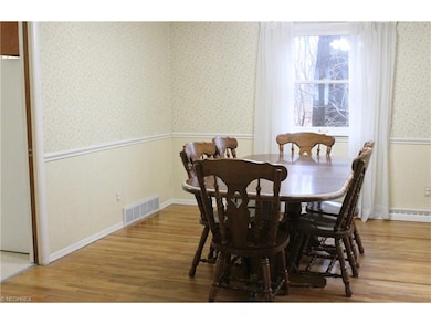 From living room, enter the dining room. Doorway l