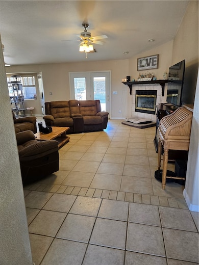 Living area featuring light tile patterned floorin