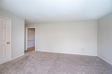 Unfurnished room featuring light carpet