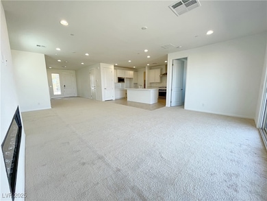 Unfurnished living room with recessed lighting and