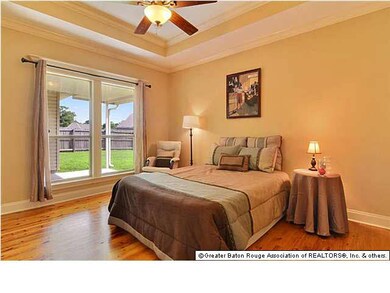 The large master bedroom has recessed ceiling with