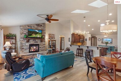 2-story stone stacked fireplace, ceiling fans, sky