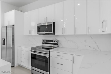Kitchen with appliances with stainless steel finis