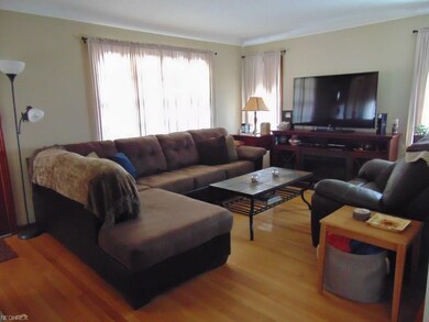 Spacious living room with hardwood flooring