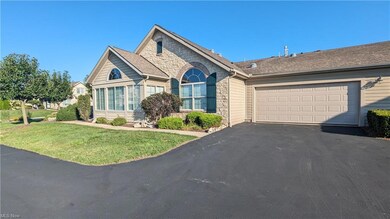 View of front of house featuring garage and a fron