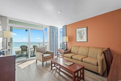Living area featuring expansive windows, a water v
