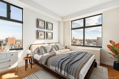 Bedroom featuring a view of city and wood finished floors