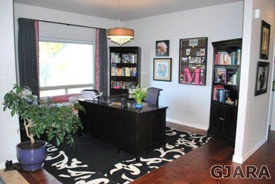 Formal Dining room is currently used as an office.