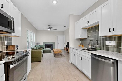 Kitchen with stainless steel appliances, a ceilin