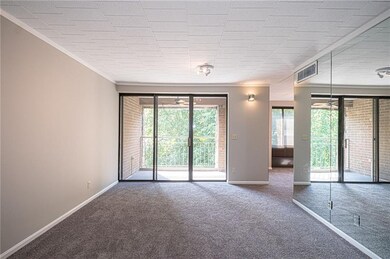 Spacious formal living room accented with a mirror