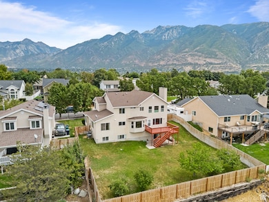 Aerial perspective of suburban area featuring a mountain backdrop