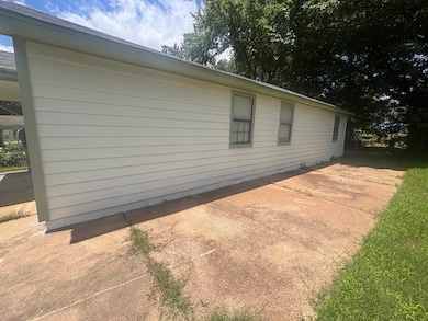 View of side of property featuring a patio area