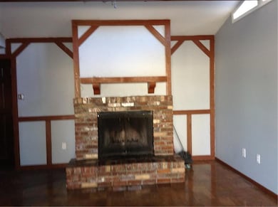 Beautiful fireplace in the den. Open and lots of n