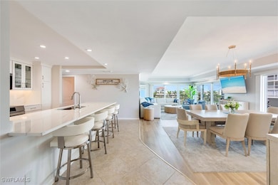 Dining area with light wood-type flooring, a notab