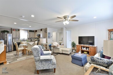Living room with light hardwood / wood-style floor