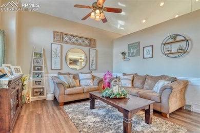 Living room with hardwood / wood-style floors and 