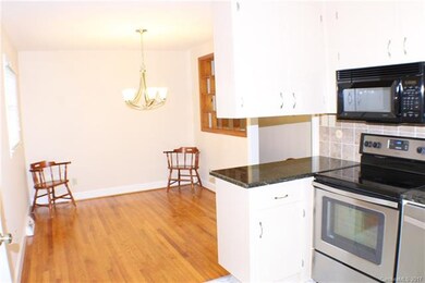 Kitchen with granite countertops, stainless applia