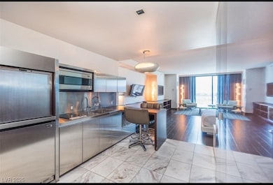 Kitchen with stainless steel microwave, floor to c