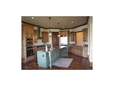Chef's dream kitch w/ gas stove, granite island & 