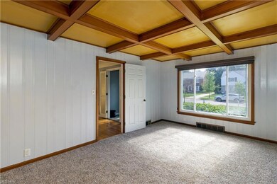 New carpeting in the family room with coffered cei