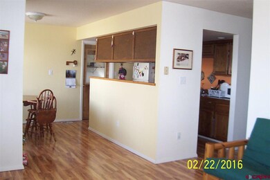 kitchen open to dining and living area