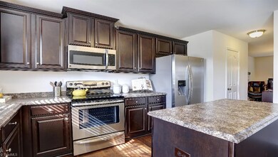 Similar home, same floor plan. Under construction. Options and colors may vary. Home decor, decorative paint and furnishings are not included. All pictures are of a decorated model and are only being used to demonstrate use of space with the plan and are not in actual home.