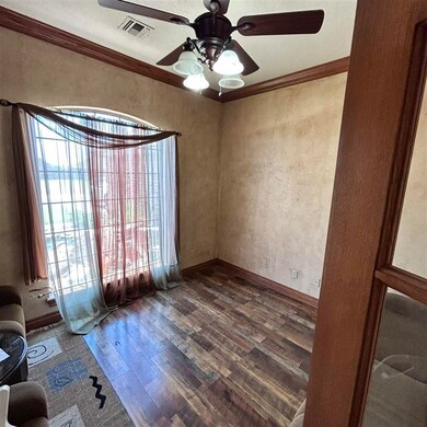 Study located West Front door with window view of 
