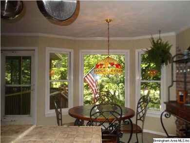 BREAKFAST ROOM WITH BAY WINDOW WITH VIEW OF GOLF C