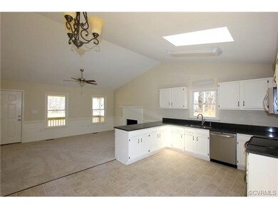 Looking from the kitchen to the living area, you c