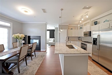 Kitchen with visible vents, ornamental molding, st