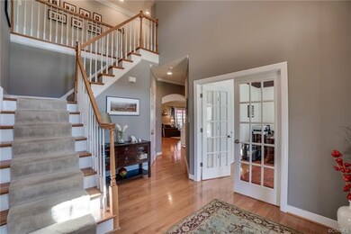 Dramatic turned staircase in 2-story Foyer.