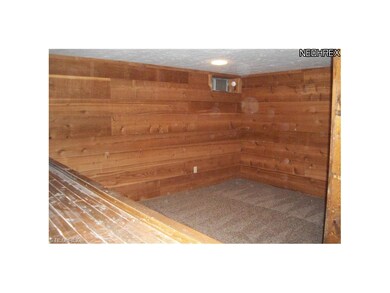 Rough sawn Cherry paneling and new carpeting in lo